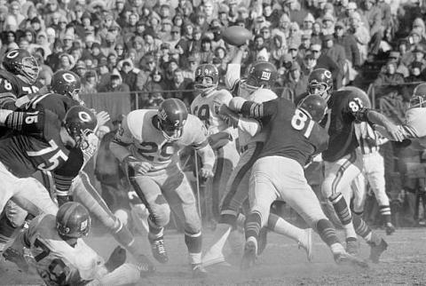 football team in a scrum, tackling each other