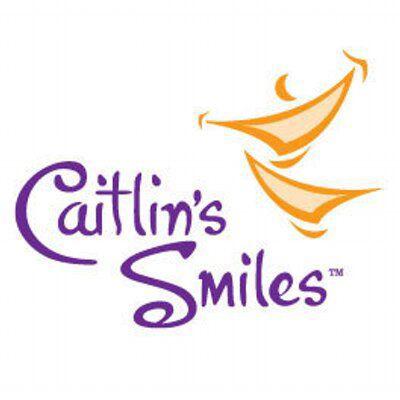 Text reads Caitlin's Smiles (tm) with two cartoon smiles stacked on top of one another.