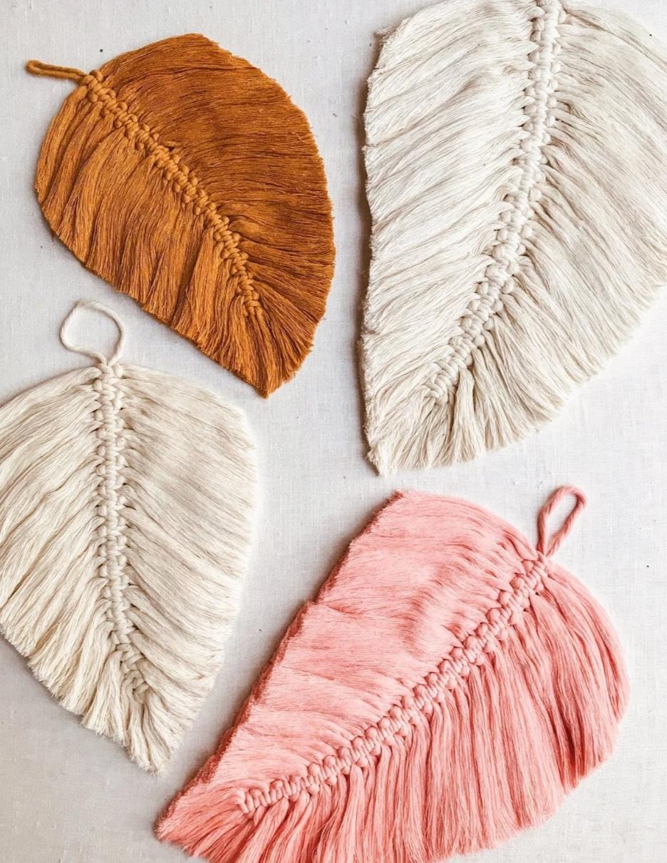 Four macrame leaves in various colors