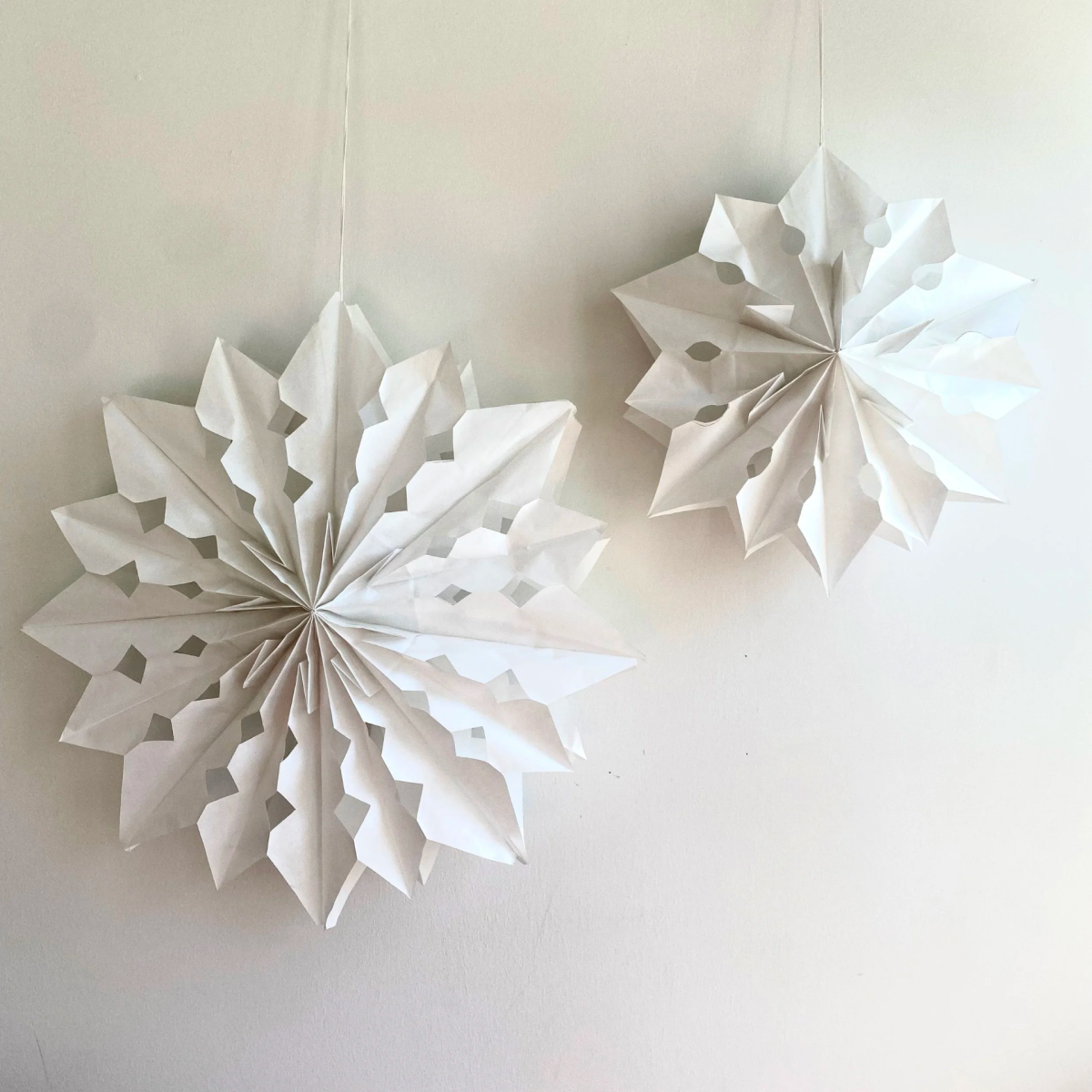 image of paper bags cut and folded to look like intricate stars